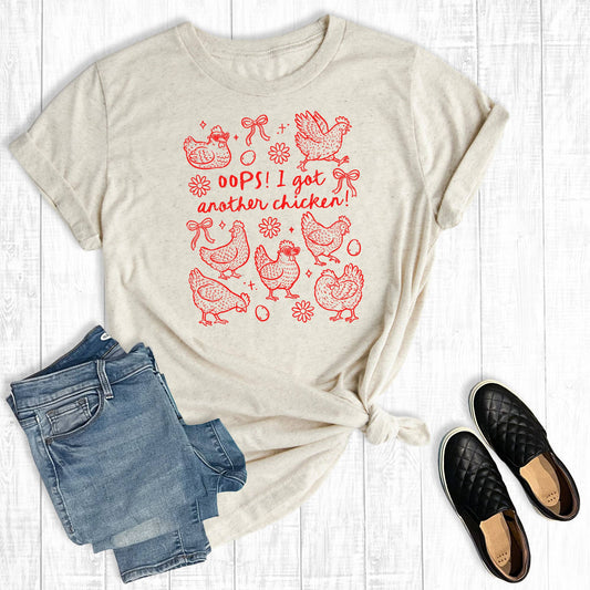 Funny Western Oops I Got Another Chicken Graphic Tee: Oat / Short Sleeve